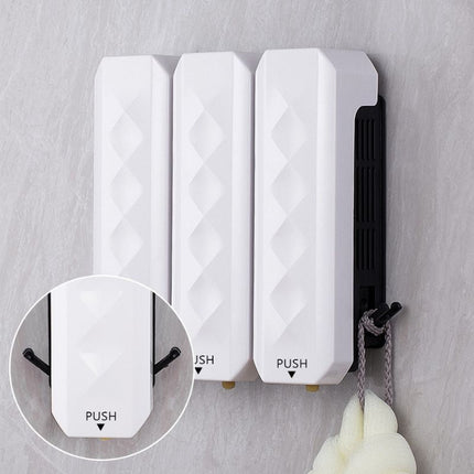 Bílý designový dávkovač mýdla na zeď